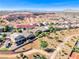 Wide angle aerial shot of neighborhood and private residence highlighting the desert landscape at 1727 Sonoran Bluff Ave, Henderson, NV 89014