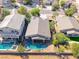 Aerial view of a private backyard with a pool, spa, and patio area perfect for outdoor enjoyment at 1727 Sonoran Bluff Ave, Henderson, NV 89014