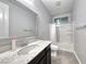 Bathroom featuring a shower-tub combo and marble counters with modern fixtures at 1727 Sonoran Bluff Ave, Henderson, NV 89014