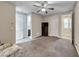 Spacious bedroom with carpet flooring, ceiling fan and natural lighting at 1727 Sonoran Bluff Ave, Henderson, NV 89014