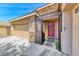 Close-up of the front entrance featuring a decorative gate, a maroon door, and stone accents at 1727 Sonoran Bluff Ave, Henderson, NV 89014