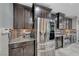Stylish kitchen with stainless steel appliances and dark wood cabinets at 1727 Sonoran Bluff Ave, Henderson, NV 89014