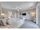 Relaxing main bedroom boasts plush carpeting, ceiling fan, and ensuite bathroom at 1727 Sonoran Bluff Ave, Henderson, NV 89014
