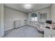 A spacious office featuring a desk, chair, and a window for natural lighting at 1727 Sonoran Bluff Ave, Henderson, NV 89014