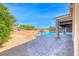 Stunning pool area with lush landscaping, rock waterfall, and a relaxing spa at 1727 Sonoran Bluff Ave, Henderson, NV 89014
