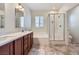 Bathroom featuring double sinks, a tub, and a glass shower at 1792 Gentle Brook St, North Las Vegas, NV 89084
