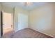 Bedroom with carpet, sliding closet doors, and a view into another room at 1792 Gentle Brook St, North Las Vegas, NV 89084
