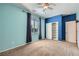 Cozy bedroom featuring carpet, bright blue walls, and closet with ample storage space at 1792 Gentle Brook St, North Las Vegas, NV 89084