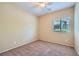 Bedroom with carpet floors, a ceiling fan, and a window at 1792 Gentle Brook St, North Las Vegas, NV 89084