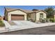Attractive single-story home with desert landscaping, a two-car garage, and neutral exterior paint at 1792 Gentle Brook St, North Las Vegas, NV 89084