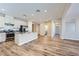Bright kitchen featuring a large island with seating, stainless steel appliances, and wood flooring at 1792 Gentle Brook St, North Las Vegas, NV 89084