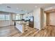 Well-lit kitchen with an island, modern appliances, and ample cabinet space at 1792 Gentle Brook St, North Las Vegas, NV 89084