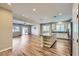 Open floor plan featuring a kitchen island, wood floors, and a seamless transition to the living room at 1792 Gentle Brook St, North Las Vegas, NV 89084