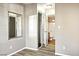 Bedroom with wood-look flooring featuring ensuite bathroom and closet at 2101 Sealion Dr # 108, Las Vegas, NV 89128
