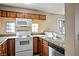 Kitchen features modern appliances, including a white range and over-the-range microwave at 2101 Sealion Dr # 108, Las Vegas, NV 89128