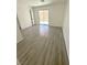 Bedroom featuring a sliding glass door to the patio, modern flooring, and neutral walls at 2105 Kendall Hill Ave, Las Vegas, NV 89106