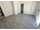Bedroom with sleek flooring, bright sliding glass door, and neutral walls at 2105 Kendall Hill Ave, Las Vegas, NV 89106