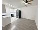 Kitchen with modern appliances, white cabinetry, and an open dining area at 2105 Kendall Hill Ave, Las Vegas, NV 89106