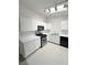 Well-equipped kitchen featuring white cabinets, modern appliances, and sleek countertops at 2105 Kendall Hill Ave, Las Vegas, NV 89106