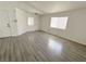 Open living room with sleek flooring, neutral walls, and bright windows at 2105 Kendall Hill Ave, Las Vegas, NV 89106