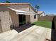Private backyard patio with concrete paving and artificial turf; perfect for outdoor relaxation at 2105 Kendall Hill Ave, Las Vegas, NV 89106