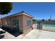 View of the community pool area, featuring a gated entrance and clear blue water on a sunny day at 2105 Kendall Hill Ave, Las Vegas, NV 89106