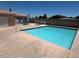 Community pool with clear blue water and lounge chairs surrounding it for residents to enjoy at 2105 Kendall Hill Ave, Las Vegas, NV 89106