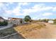 Backyard featuring a shaded pergola, expansive yard and desert landscaping for outdoor activities at 2230 Wagon Ave, Pahrump, NV 89048