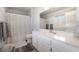 Bright bathroom featuring a shower-tub combination, white vanity, and wood-look flooring at 2230 Wagon Ave, Pahrump, NV 89048