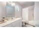 Bathroom featuring white vanity and sink, shower-tub combination, octagon window at 2230 Wagon Ave, Pahrump, NV 89048