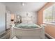 Bedroom with window, bed, and doorway to additional rooms at 2230 Wagon Ave, Pahrump, NV 89048