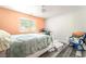 Spacious bedroom showcasing a large window, wood-look floors, and neutral walls at 2230 Wagon Ave, Pahrump, NV 89048