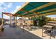 Relaxing pergola with patio seating, perfect for outdoor dining and enjoying the peaceful surroundings at 2230 Wagon Ave, Pahrump, NV 89048