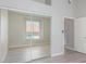 This bedroom features a window with blinds, a sliding-door closet, and light gray laminate flooring at 2305 W Horizon Ridge Pkwy # 524, Henderson, NV 89052