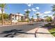 Exterior view of the Mission Hills apartment community with mature landscaping, palm trees, and lush greenery at 2305 W Horizon Ridge Pkwy # 524, Henderson, NV 89052