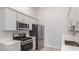 Stylish kitchen featuring stainless steel appliances, gray cabinetry, and elegant countertops at 2305 W Horizon Ridge Pkwy # 524, Henderson, NV 89052