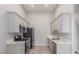 Modern kitchen with stainless steel appliances, light gray cabinets, and sleek countertops at 2305 W Horizon Ridge Pkwy # 524, Henderson, NV 89052