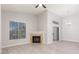 Bright living space showcases neutral walls, wood floors, a fireplace, and sliding glass doors at 2305 W Horizon Ridge Pkwy # 524, Henderson, NV 89052