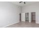 Spacious main bedroom featuring neutral walls, ceiling fan, wood-look floors, closet, and bathroom access at 2305 W Horizon Ridge Pkwy # 524, Henderson, NV 89052