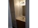 A small bathroom featuring a vanity with a mirror and lighting at 256 Camino Viejo St, Henderson, NV 89012