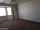 Large bedroom with natural light and neutral walls, featuring carpeted flooring at 256 Camino Viejo St, Henderson, NV 89012