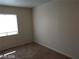 Bedroom featuring neutral walls and carpet, with a window for natural light at 256 Camino Viejo St, Henderson, NV 89012
