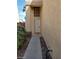 View of the front entrance with a white door, decorative window above, and a narrow walkway at 256 Camino Viejo St, Henderson, NV 89012
