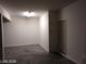 Empty garage with concrete floor, white walls, and a standard door at 256 Camino Viejo St, Henderson, NV 89012