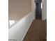 Hallway area with neutral walls and carpet, offering access to various rooms at 256 Camino Viejo St, Henderson, NV 89012