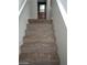 Carpeted staircase leading to an upper level of the home, showcasing easy access at 256 Camino Viejo St, Henderson, NV 89012