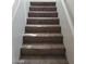 Carpeted staircase featuring neutral tones connecting different levels of the home at 256 Camino Viejo St, Henderson, NV 89012