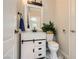 Stylish half bathroom featuring a modern vanity and mirror at 2608 Prospector Mine Ave, North Las Vegas, NV 89031