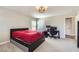 Spacious bedroom with gray carpet and two desk stations at 2608 Prospector Mine Ave, North Las Vegas, NV 89031