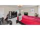 Spacious carpeted bedroom featuring a large desk and a wall-mounted television at 2608 Prospector Mine Ave, North Las Vegas, NV 89031